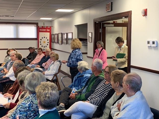 A group of people seated in chairs